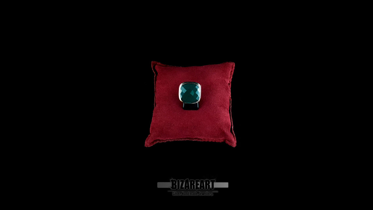 Byzantine sterling silver ring with green onyx displayed on red velvet pillow