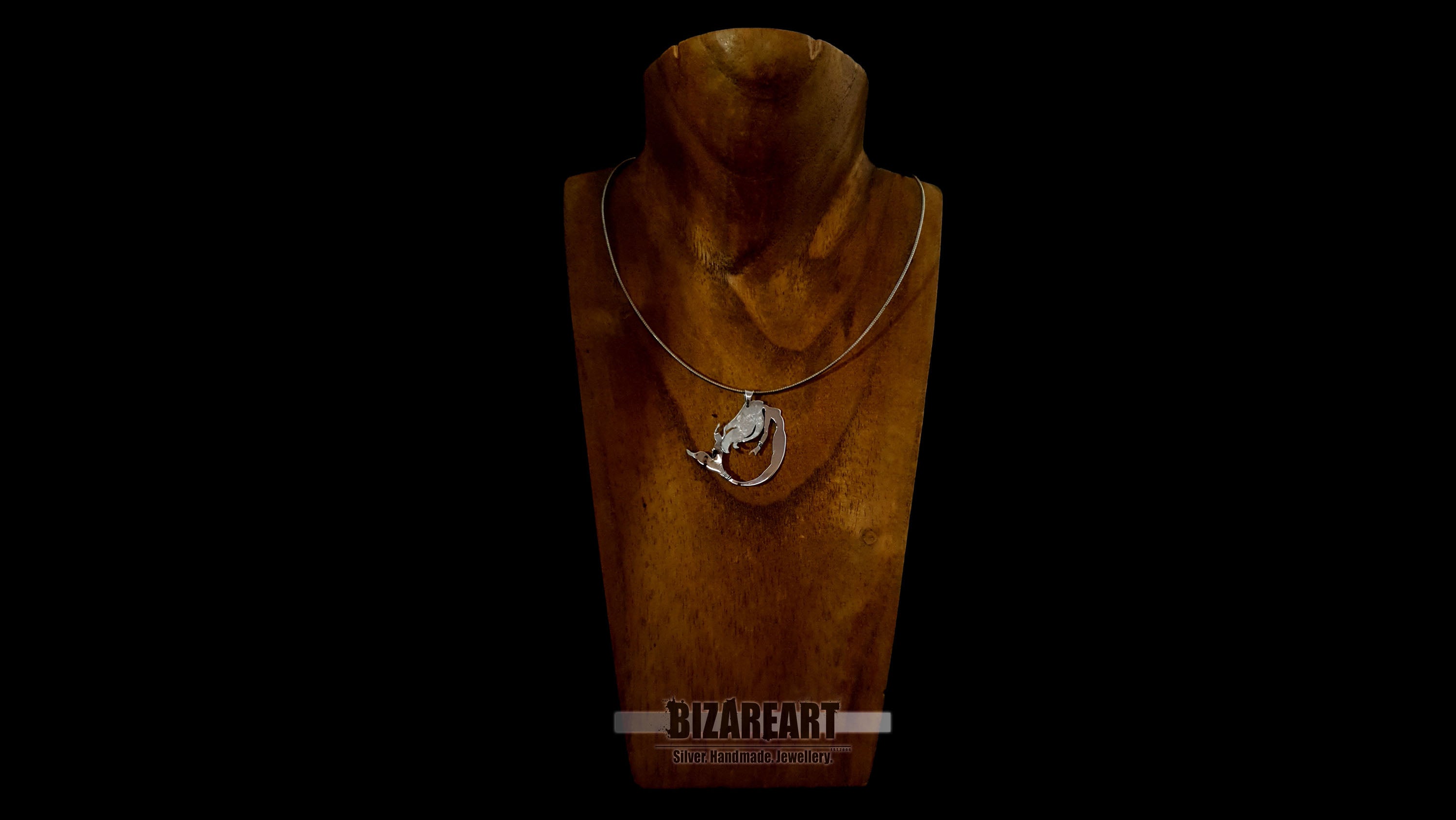 Mythological silver mermaid necklace worn to show pendant size