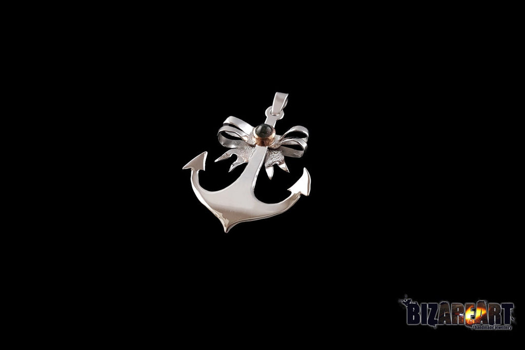 A front-facing view of the silver anchor necklace, highlighting the symmetrical "fat and shiny" design of the shank and arms under professional lighting.