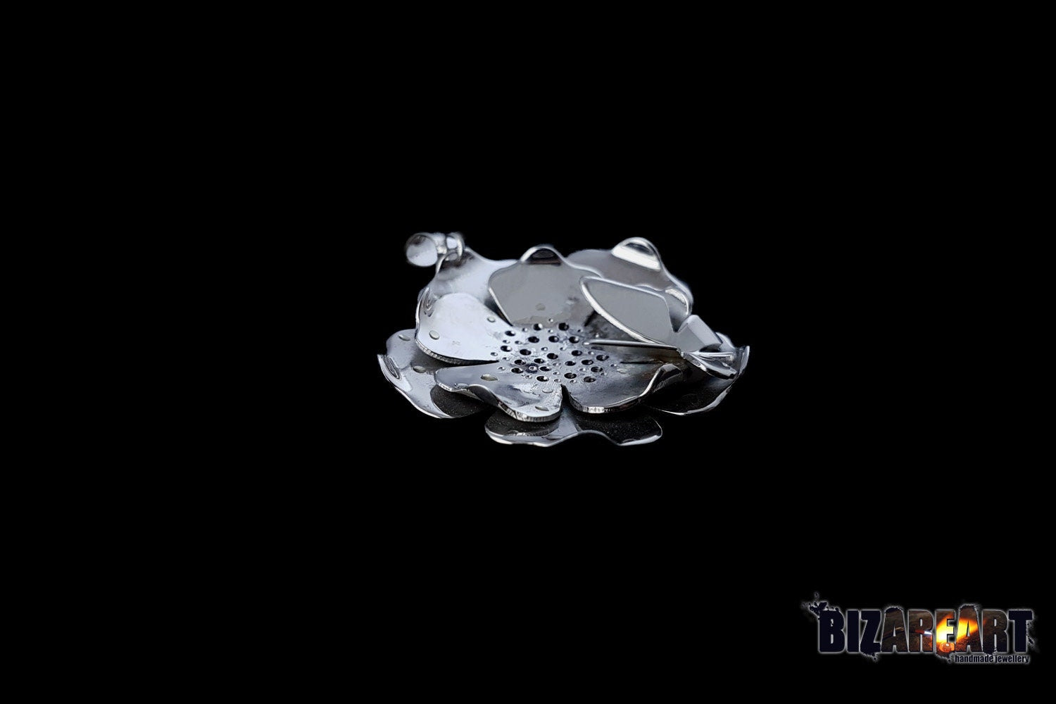 Front view of the solid silver Lotus Water Lily necklace, showing the intricate layered petals, butterfly detail, and a black enamel center.