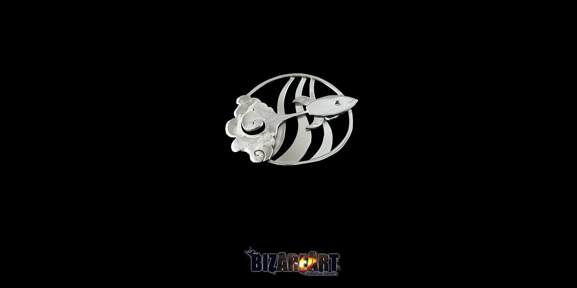 Three-quarter perspective of the sterling silver rocket pendant, emphasizing the selective blur texturing and handcrafted finish.