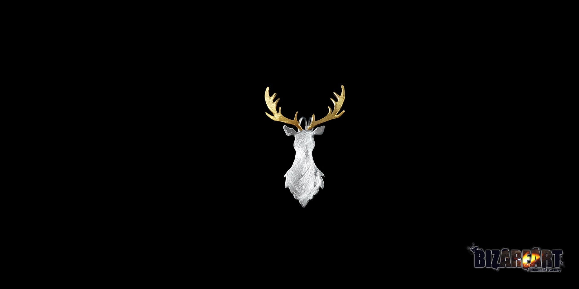 Front-facing studio shot of the dual-tone deer necklace pendant, highlighting the symmetrical gold antlers against the matte silver-white textured face.