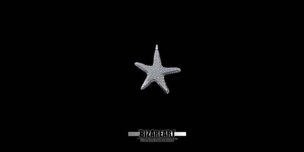 Three-quarter view of the starfish jewelry piece showcasing the carved edge lines and dimensional, abrasive texturing that mimics real sea star anatomy.