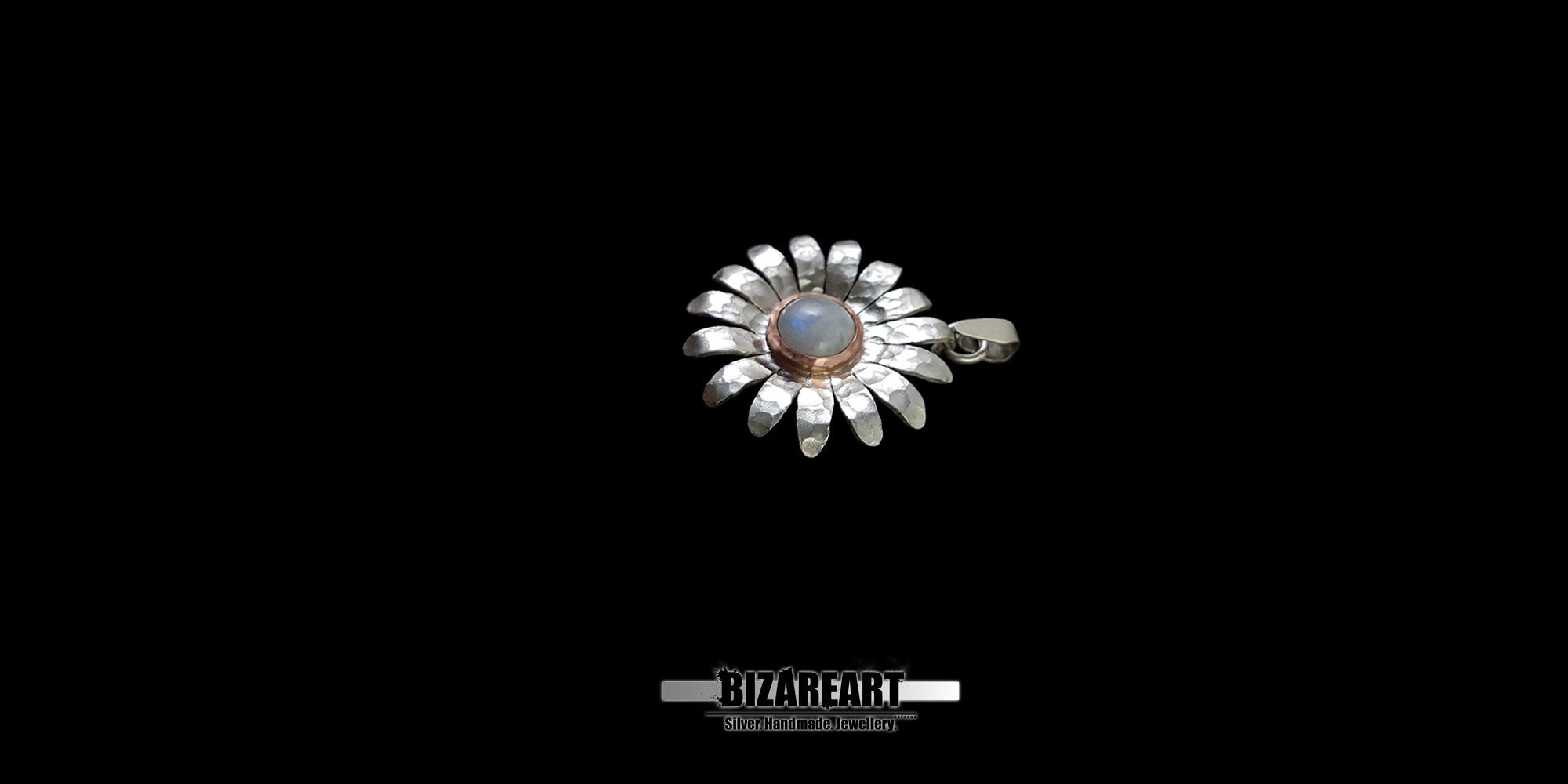 Side view of the textured silver daisy pendant, demonstrating the depth, 3D structure, and artisanal craftsmanship of the mixed-metal design.
