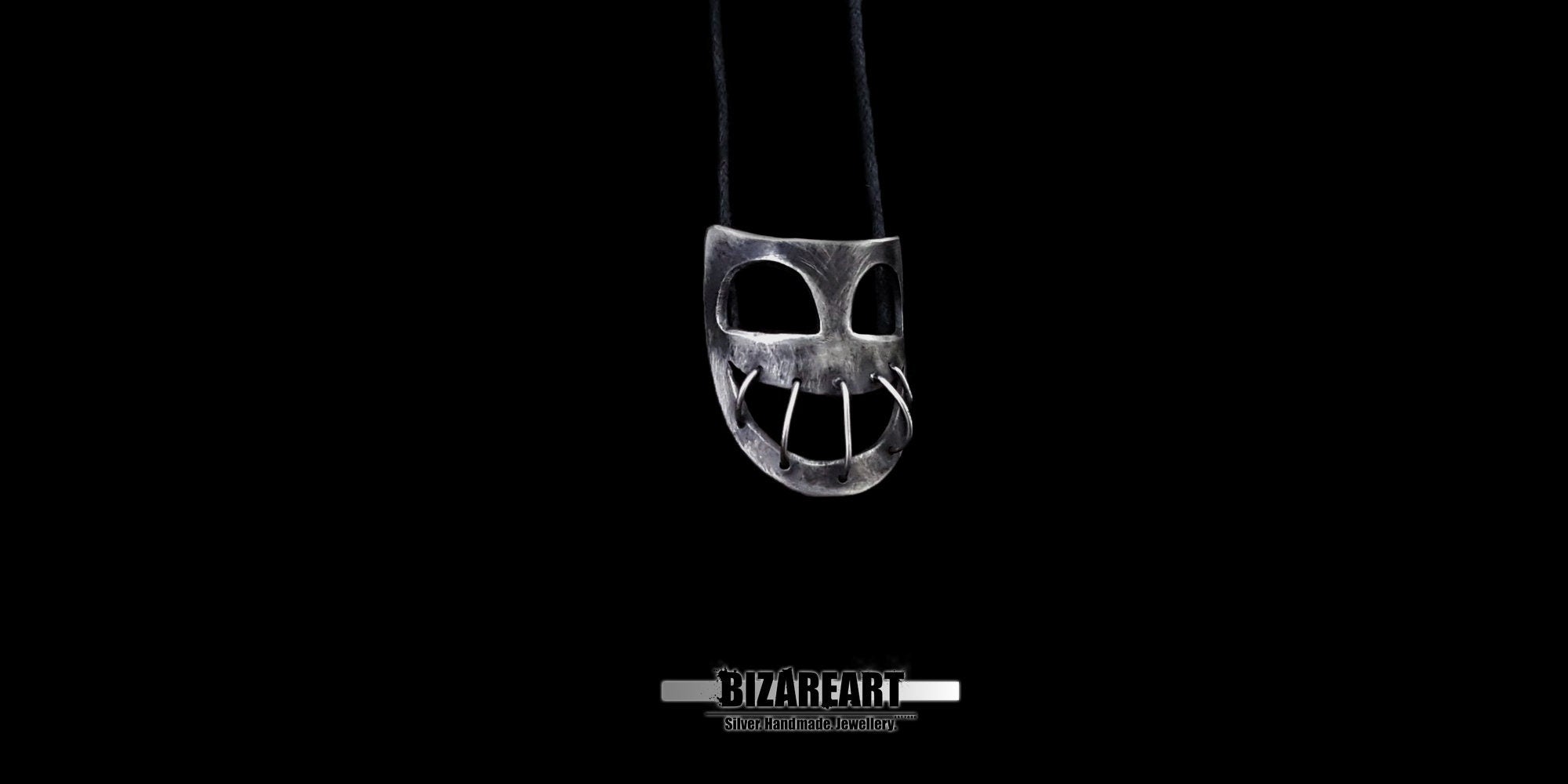 Front view of a handcrafted 925 sterling silver mask pendant by Bizareart, featuring an industrial wire-stitched mouth design suspended against a solid black background.