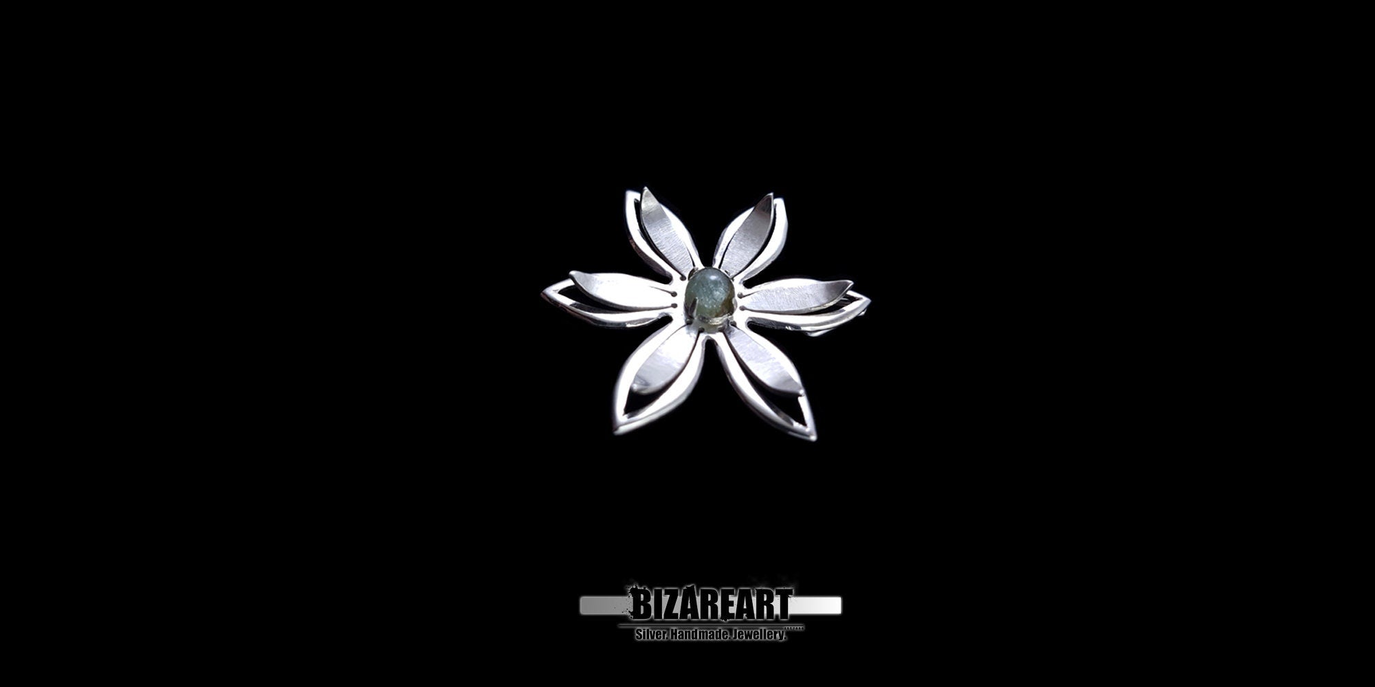 A series of product photography shots showing the silver flower pendant from various angles on a black background, highlighting the metallic sheen and the depth of the central gemstone.