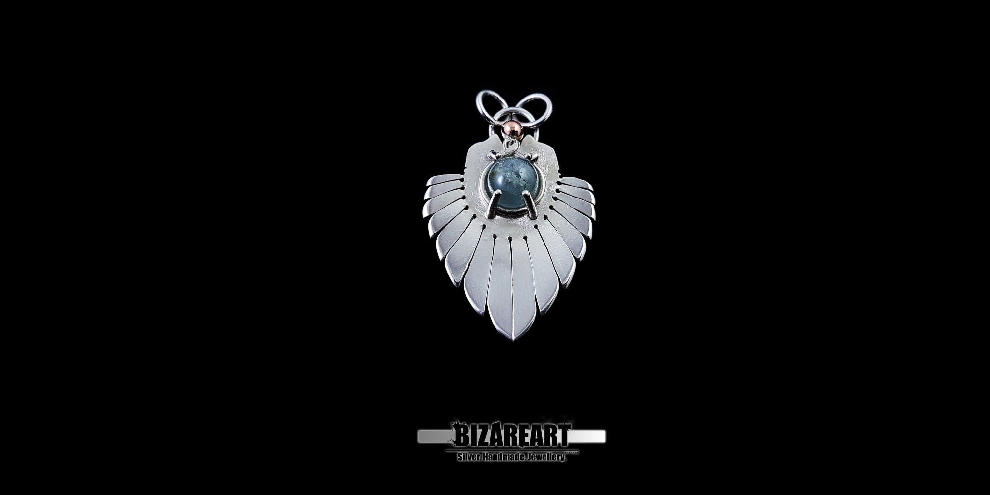 Centered studio shot of the Silver Wings Pendant highlighting the intricate silver wire hanger and symmetrical wing-inspired design.