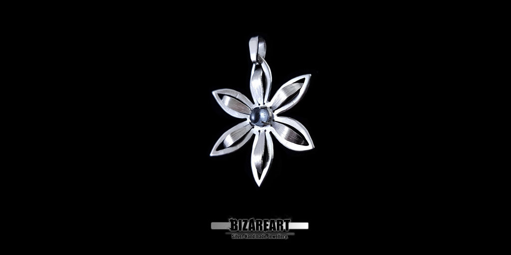 Symmetrical nature-inspired silver pendant showcasing a matte and polished finish.