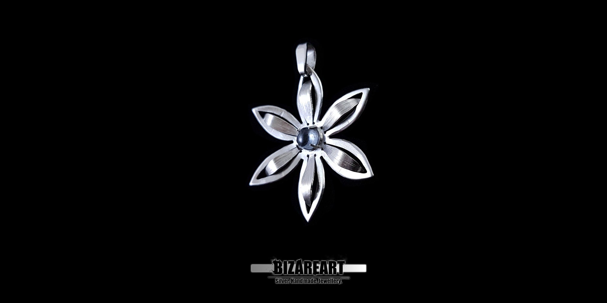 Symmetrical nature-inspired silver pendant showcasing a matte and polished finish.