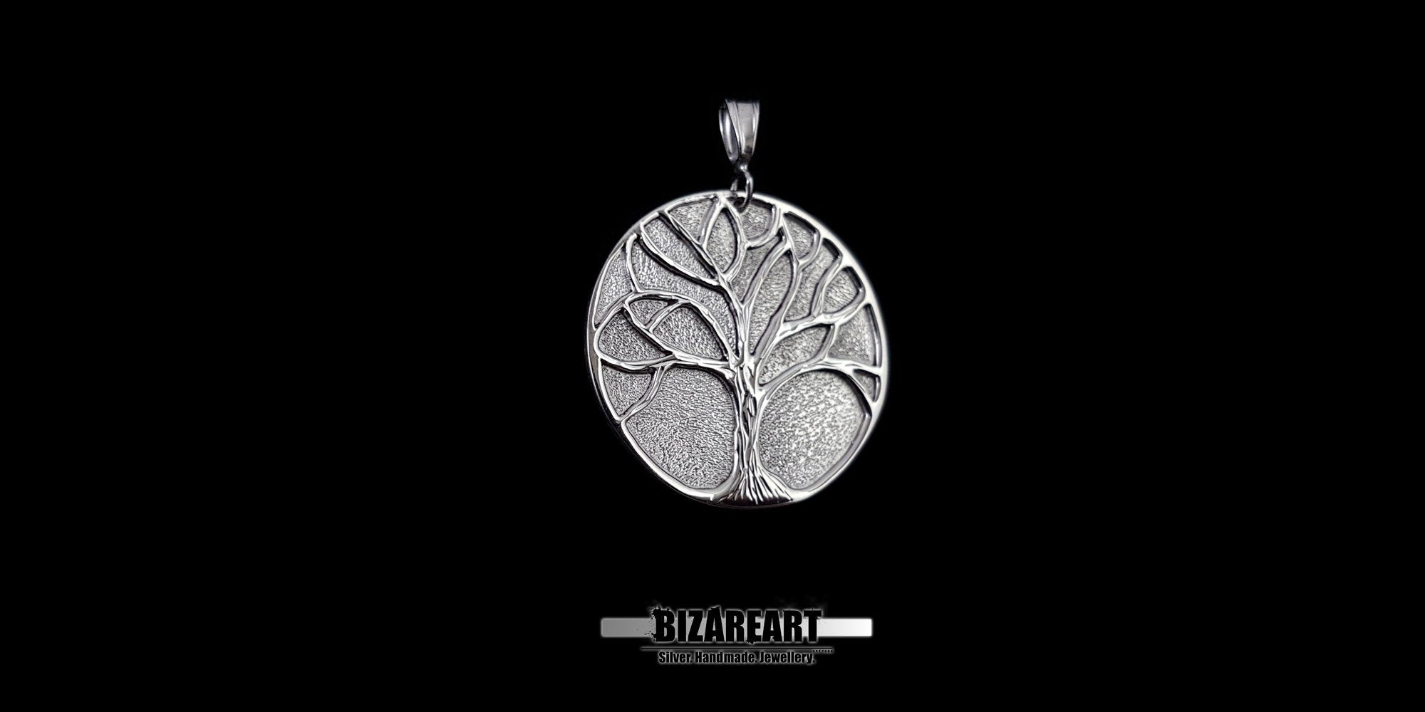 Close-up of the dark oxidized silver foreground and polished tree branches