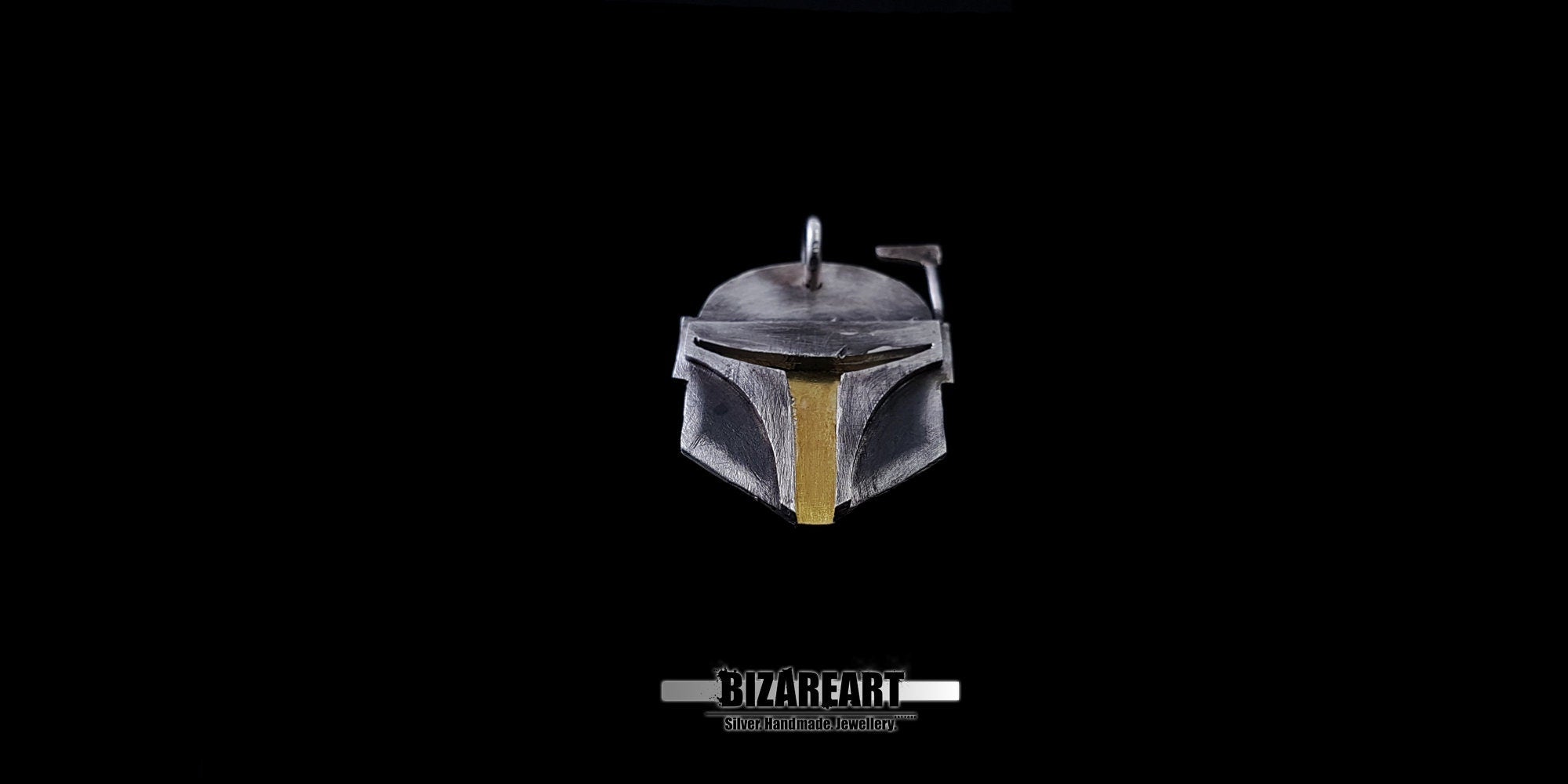 top down profile of the sterling silver Boba Fett helmet jewelry, highlighting the metallic texture and design depth.