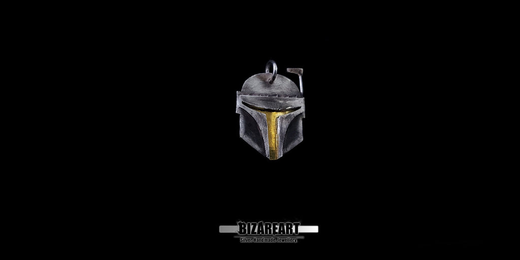 Front view of the silver Mandalorian helmet pendant, showcasing the intricate artisan craftsmanship.