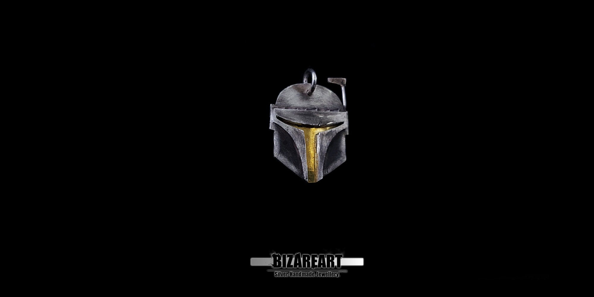 Front view of the silver Mandalorian helmet pendant, showcasing the intricate artisan craftsmanship.