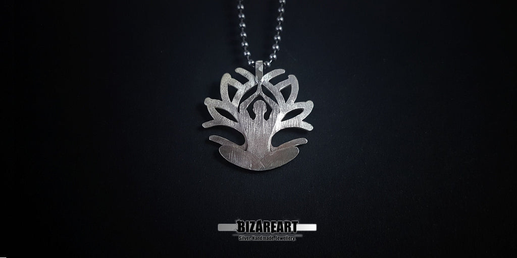 A wide-angle view of the pendant centered on a black backdrop, showcasing the balance of the lotus-inspired silhouette.