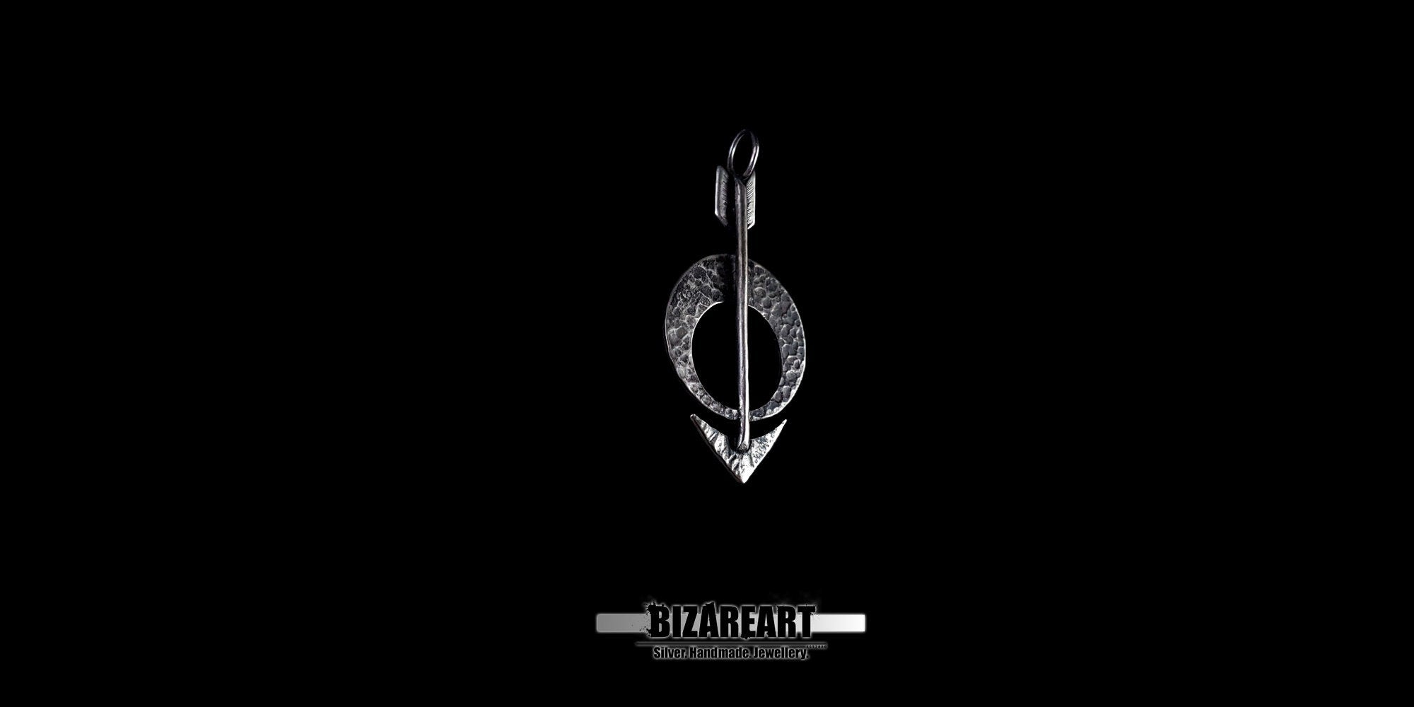 Front view of the Silver Moon Arrow Pendant centered on a black background, showcasing the intricate hammered texture of the crescent moon and arrow tip.