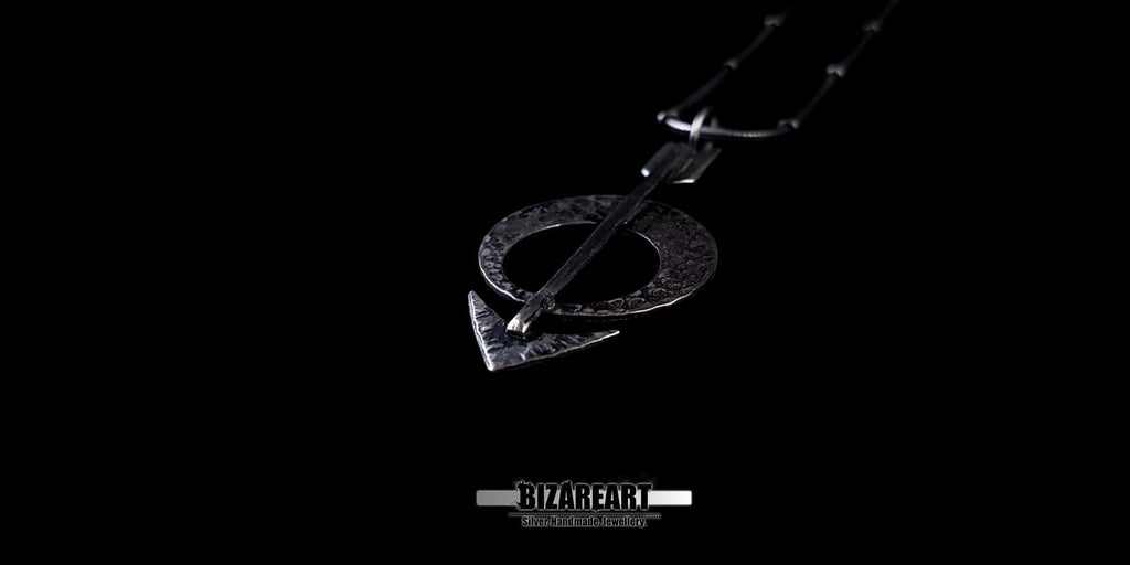 Three-quarter side profile of the pendant, emphasizing the 3D depth and hammered metal craftsmanship.