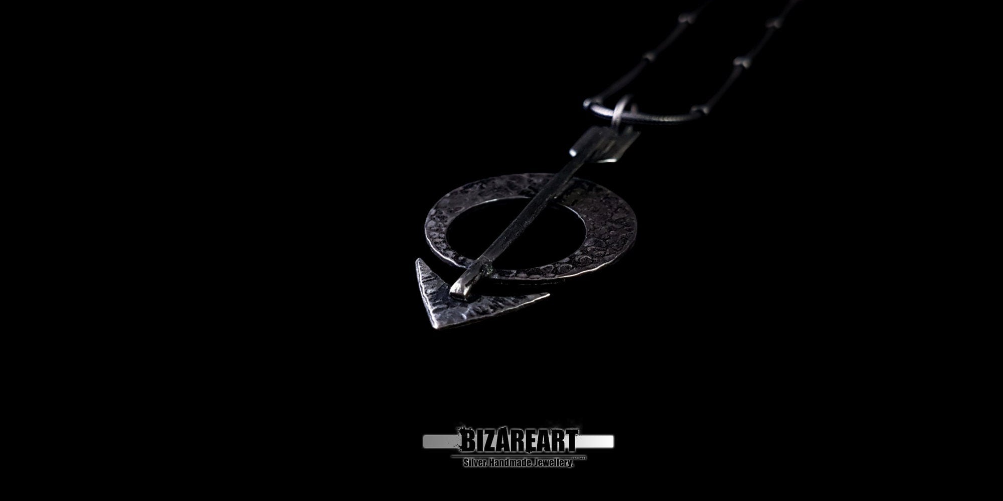 Three-quarter side profile of the pendant, emphasizing the 3D depth and hammered metal craftsmanship.
