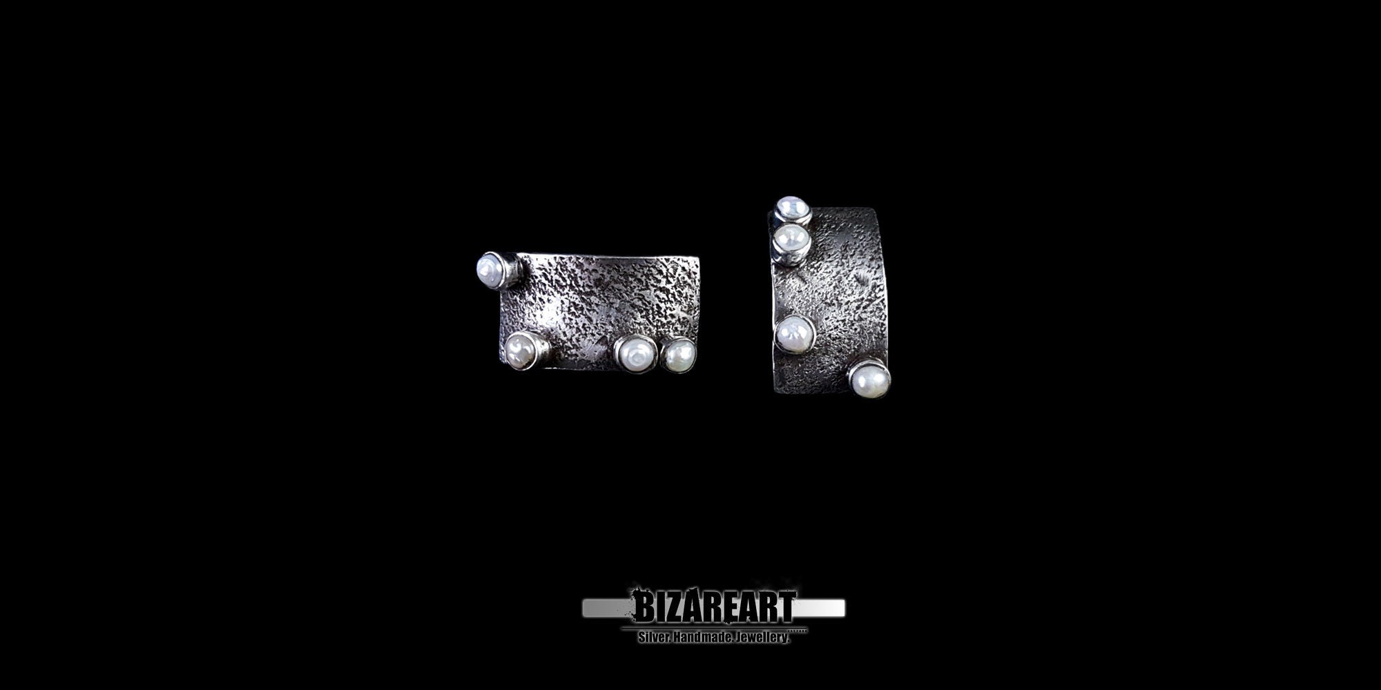 Side-by-side view of artisan silver studs showing the unique dimpled metal pattern and secure pearl settings.