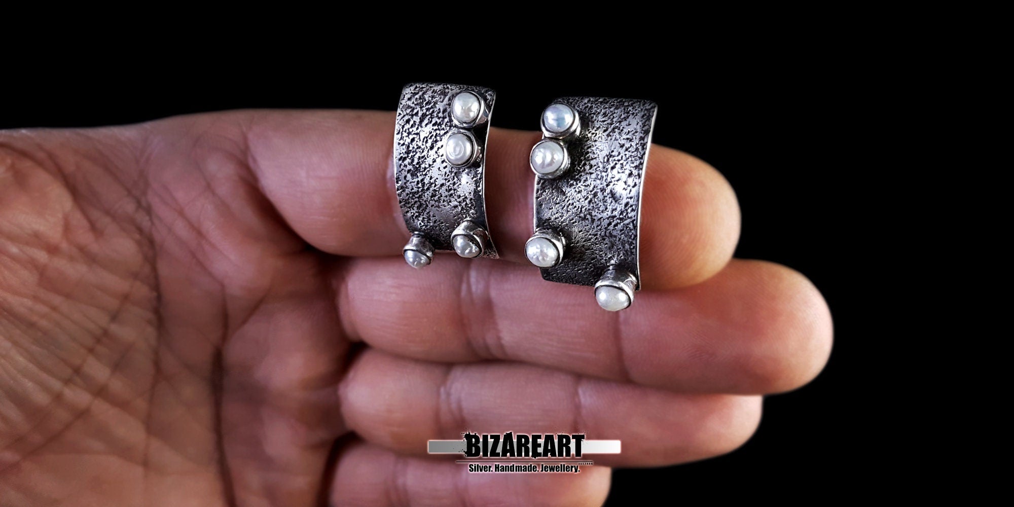 Silver Rectangle White Pearl Earrings held in hand to demonstrate size and artisan scale.
