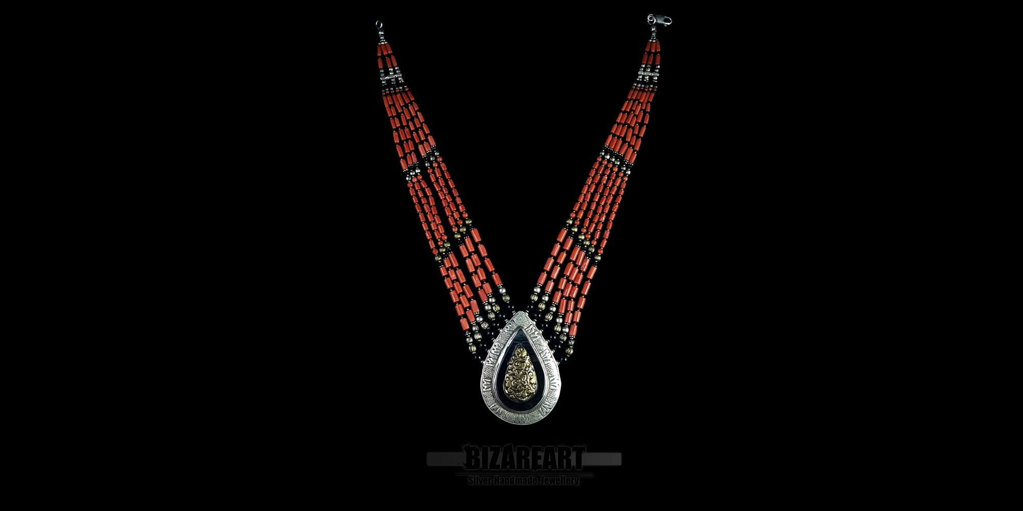 Full length view of the hand-assembled masterpiece features six tiers of vibrant red coral and aged silver, anchored by a monumental teardrop pendant. A tactile bridge between ancient ritual and contemporary sculpture, designed for the connoisseur of global history.