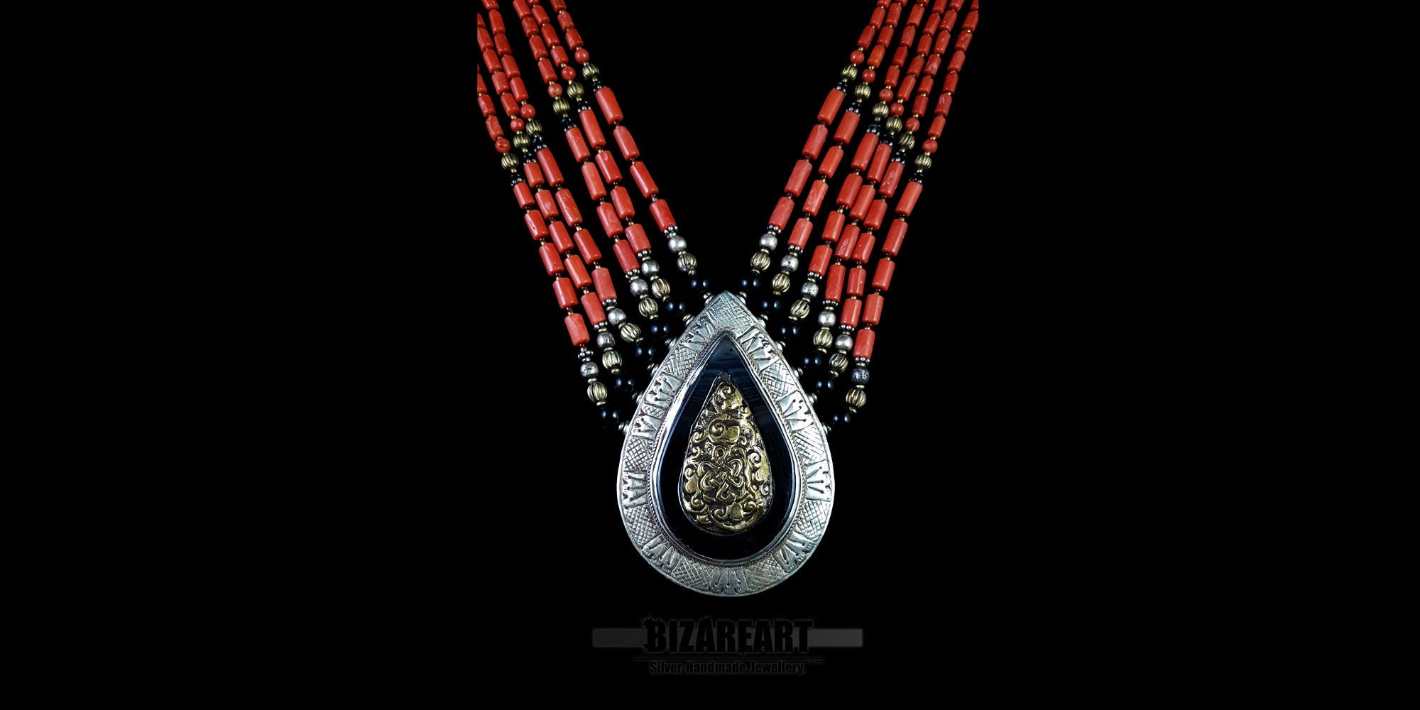 This hand-assembled masterpiece features six tiers of vibrant red coral and aged silver, anchored by a monumental teardrop pendant. A tactile bridge between ancient ritual and contemporary sculpture, designed for the connoisseur of global history.