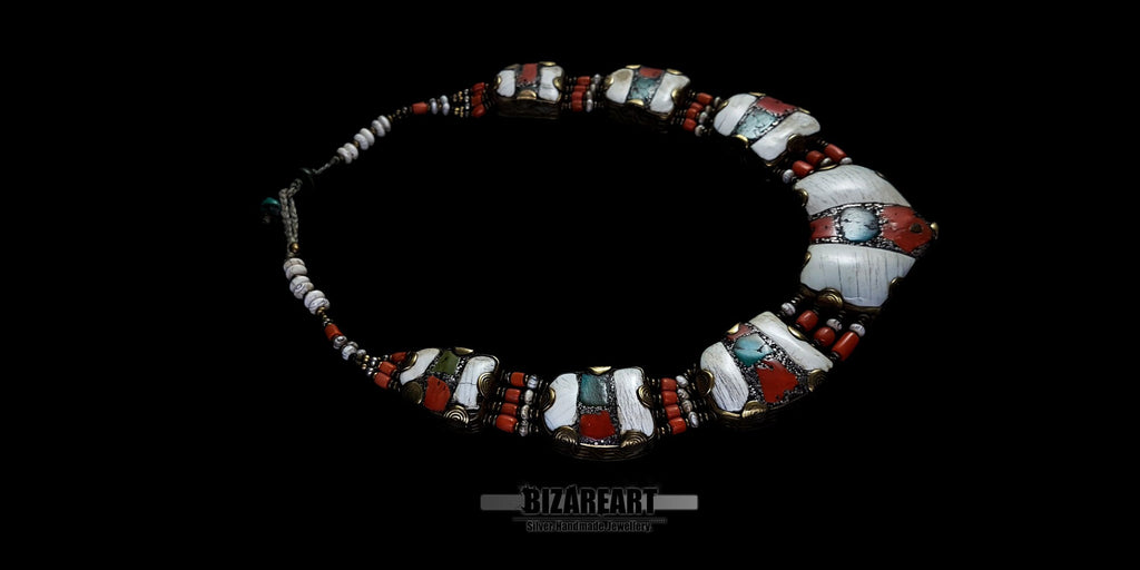 Overhead wide angle of the vintage double-sided Himalayan necklace, emphasizing the multi-segmented design and traditional tribal craftsmanship.