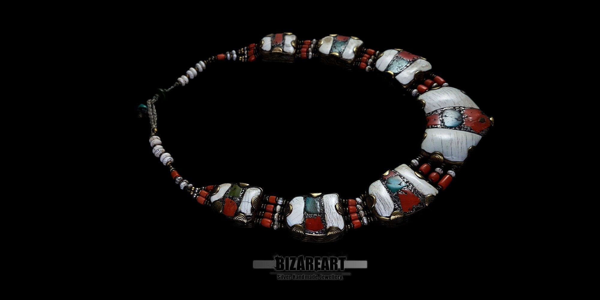 Overhead wide angle of the vintage double-sided Himalayan necklace, emphasizing the multi-segmented design and traditional tribal craftsmanship.