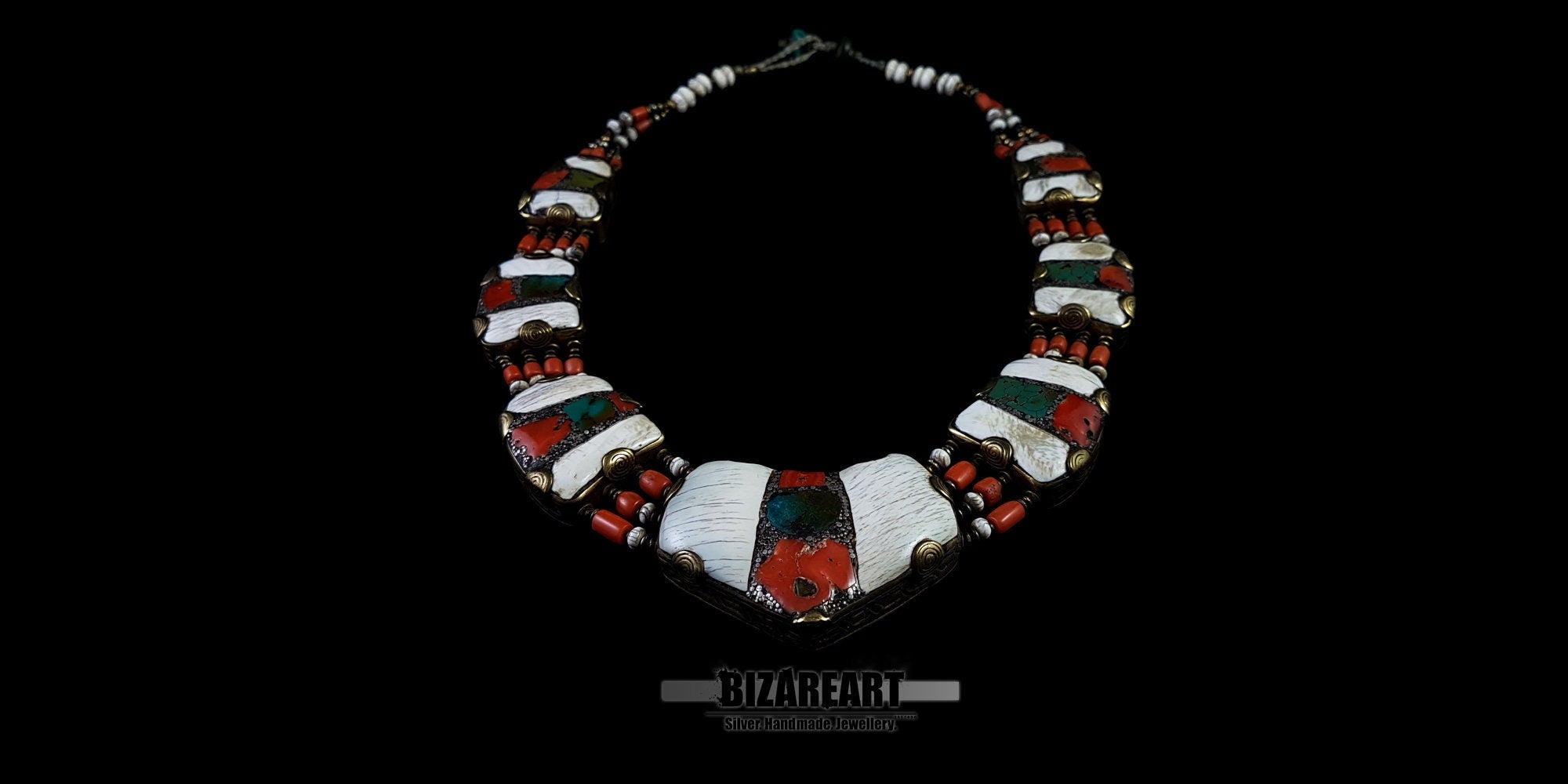 Symmetrical flat lay of the complete vintage Himalayan necklace, highlighting the repeating white conch shell panels inlaid with red coral and turquoise.