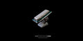 Angled side view of a large handcrafted Tibeto-Nepalese silver ring featuring an elongated white conch cabochon, turquoise inlay border, and a bezel-set red coral stone on the shank, displayed on a ring stand against a black background.