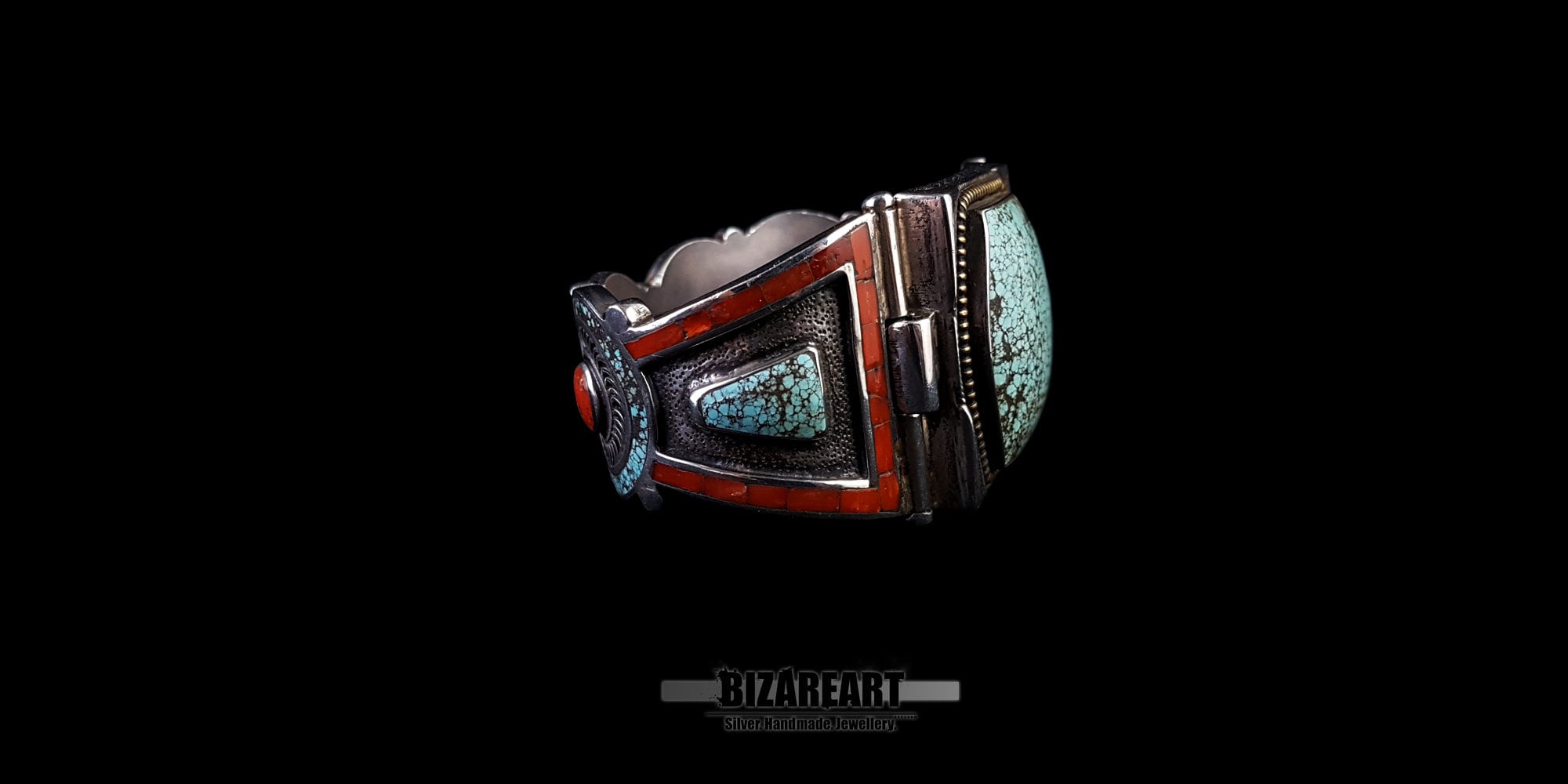 A 3/4 profile angle view that emphasizes the height and dimension of the large turquoise stone and the layering of the surrounding silver bezel. Shot on a black surface.