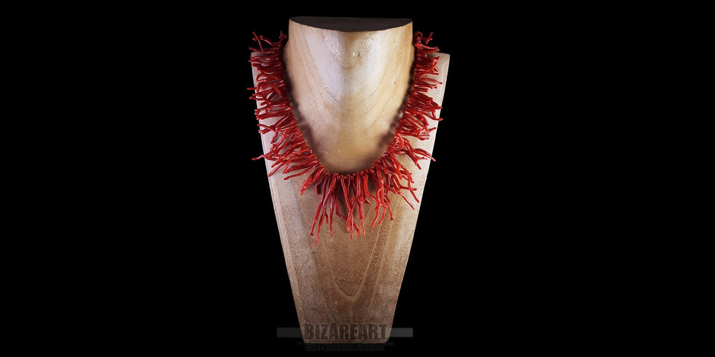 Handmade red coral branch necklace styled on a jewelry display bust to show fit and scale