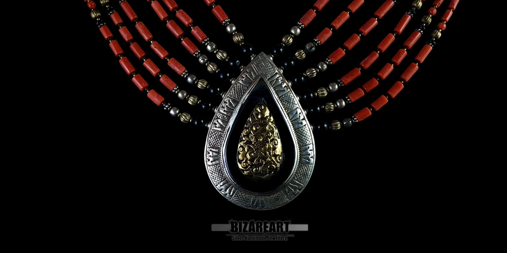 A formidable artifact of Himalayan heritage. This hand-assembled masterpiece features six tiers of vibrant red coral and aged silver, anchored by a monumental teardrop pendant. A tactile bridge between ancient ritual and contemporary sculpture, designed for the connoisseur of global history.