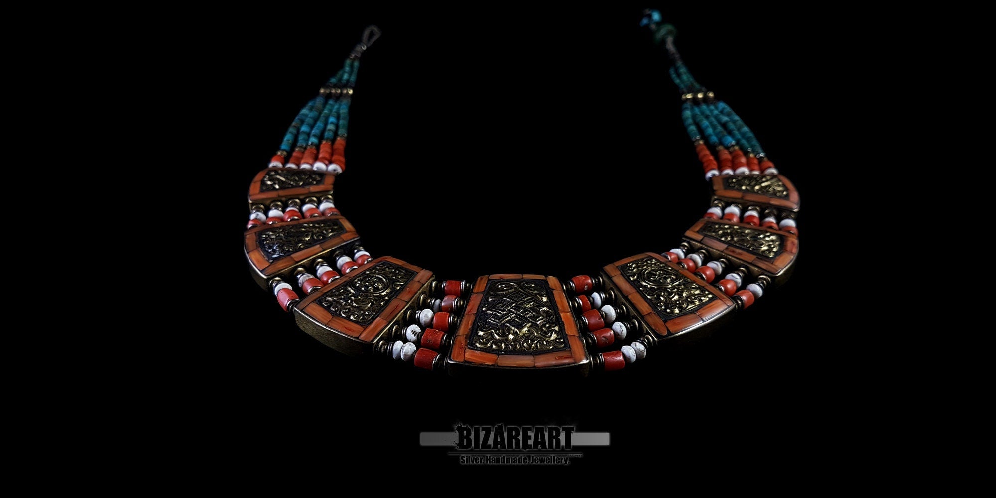 Flat lay perspective of the 5-strand Tibetan necklace highlighting the bronze spacers and curved multi-plaque design.