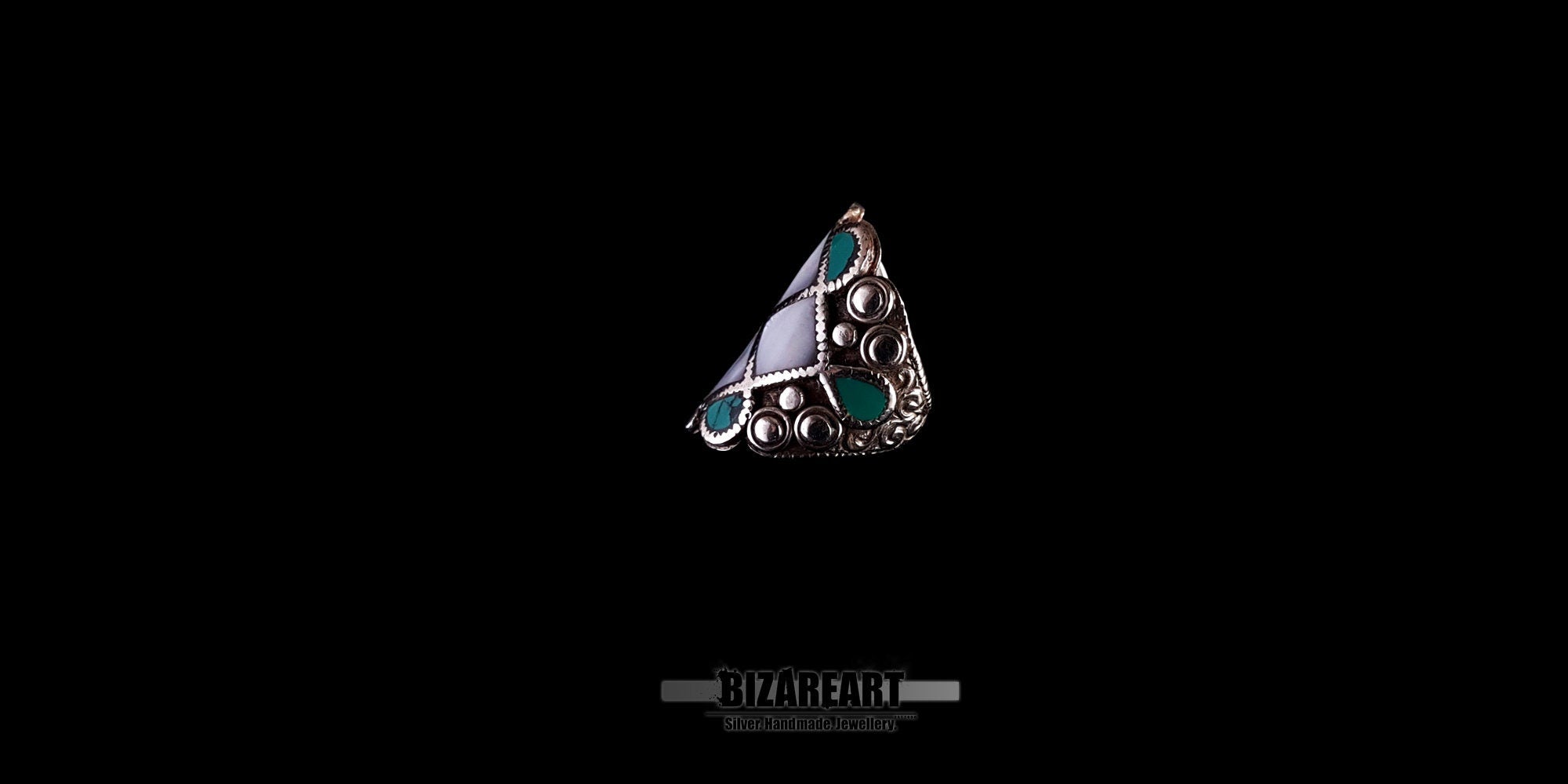 Close-up profile view of the vintage turquoise and white conch silver ring, showing the textured artisan craftsmanship.