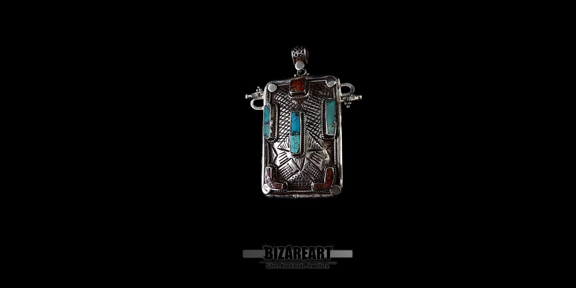 Close-up side view of hammered sterling silver texture and genuine Himalayan turquoise settings on a collectible pendant.