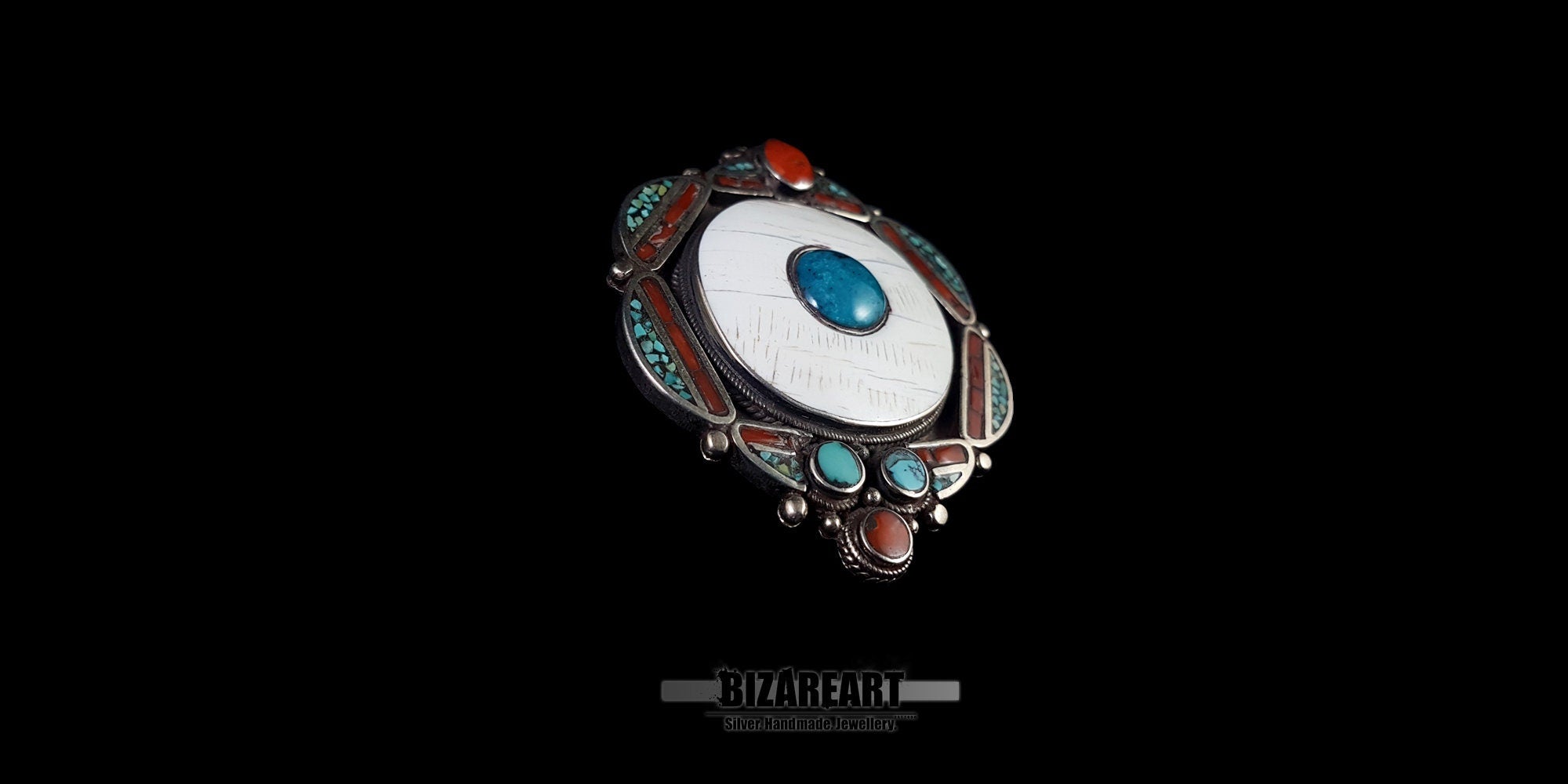 Side angle view showing the craftsmanship, thickness, and silver details of the 51g vintage Tibeto-Nepalese pendant.