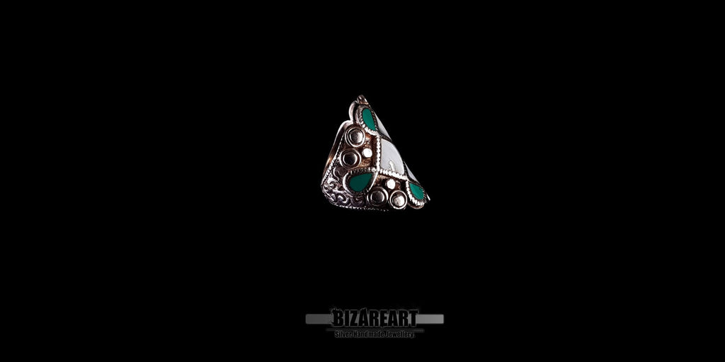 Angled side view of the handmade Himalayan silver ring, highlighting the detailed engraving and thick low-dome shank band.