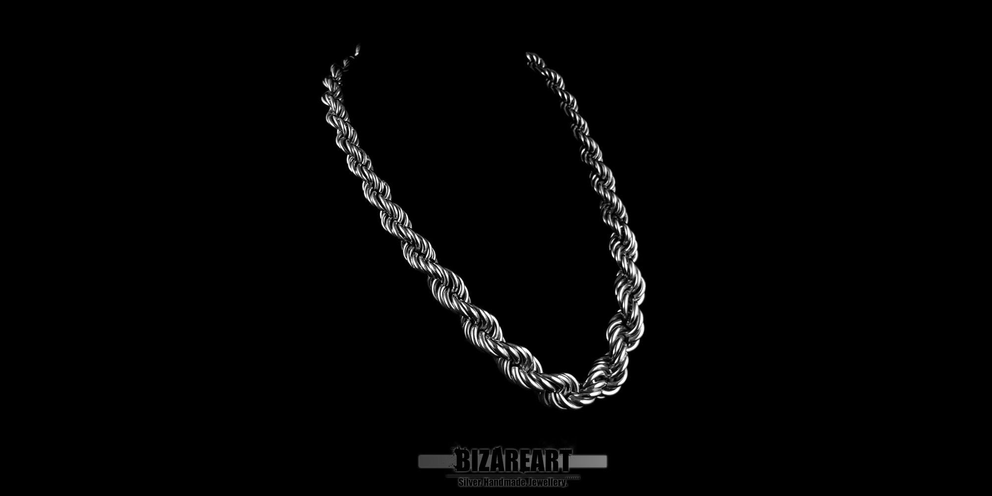 Three-quarter perspective of a heavy silver rope chain, highlighting the intricate interwoven texture and metallic luster.
