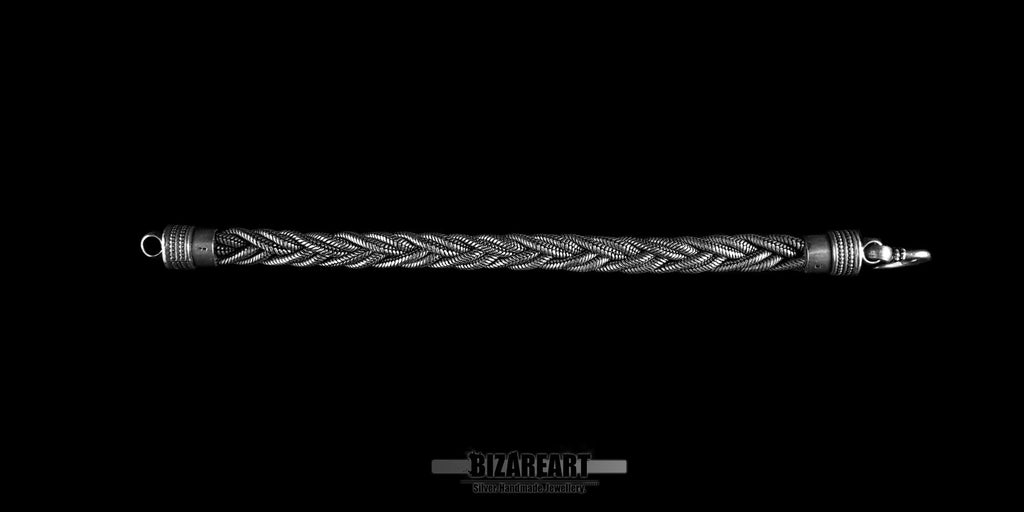 Full length straight-line view of a 20cm oxidized sterling silver triple rope bracelet, showing the seamless transition from the braided wire to the solid end caps and clasp.