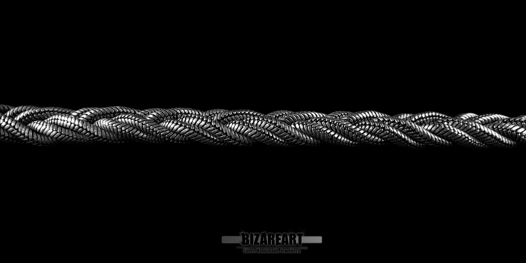 Detailed horizontal macro shot of the braided silver wire texture on a handmade Greek artisan rope bracelet.
