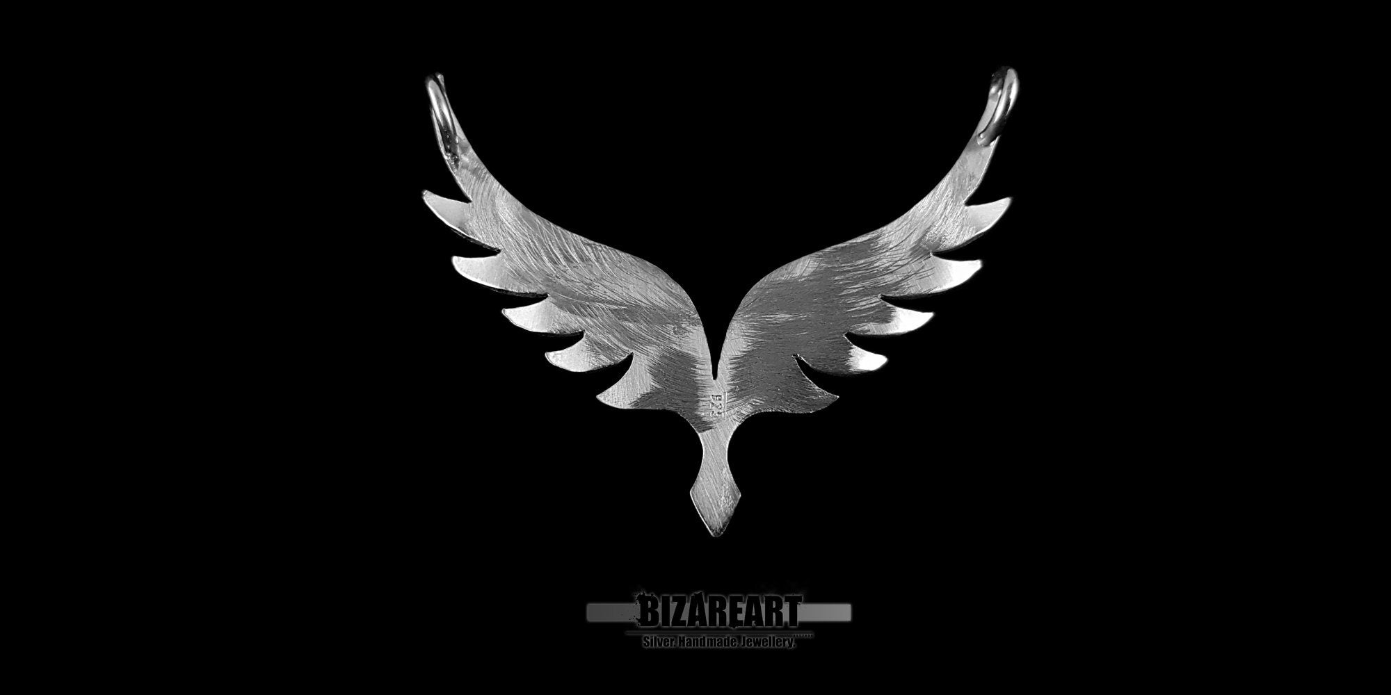 Rear view of the 925 sterling silver wing pendant, showcasing the smooth, high-quality wax finish and craftsmanship.