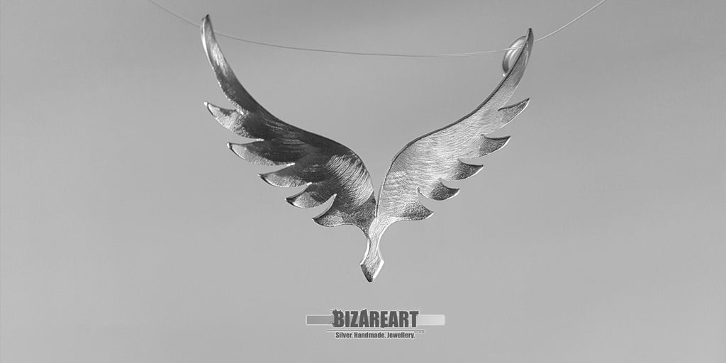 The Angel Wings v5.0 pendant suspended to show how the dual secure hangers balance the 6-gram solid silver piece.
