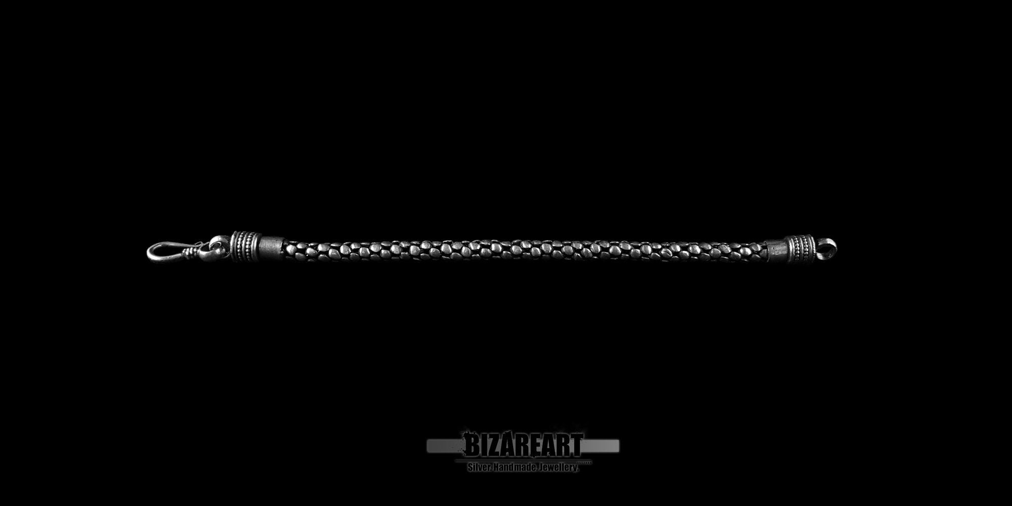 Fully extended 19cm handmade silver bracelet showing the entire length and fishhook style clasp.