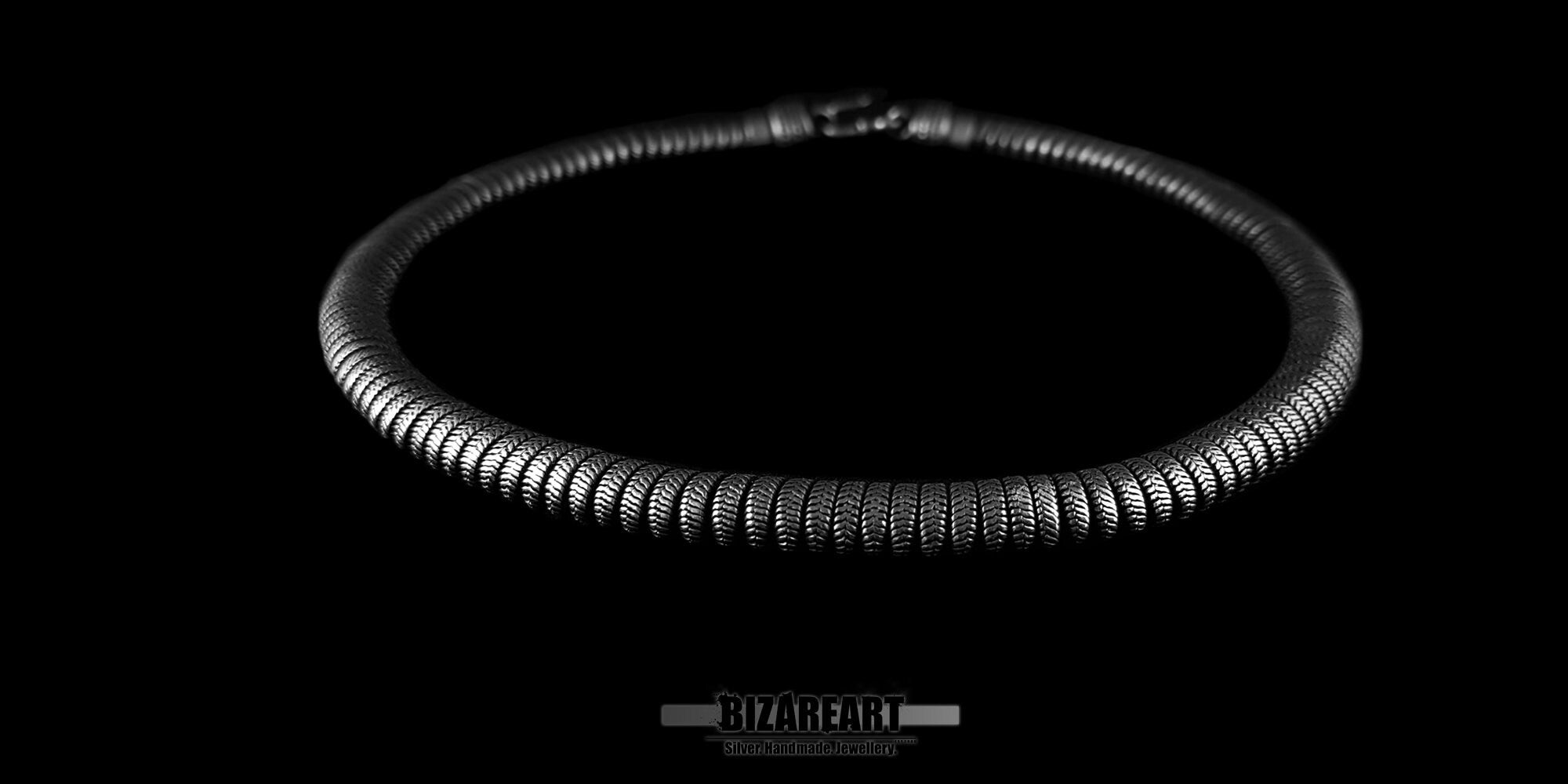 Top-down perspective of the 43cm Indian silver necklace, showcasing the uniform, individually cast snake links and the integrated silver hook clasp.