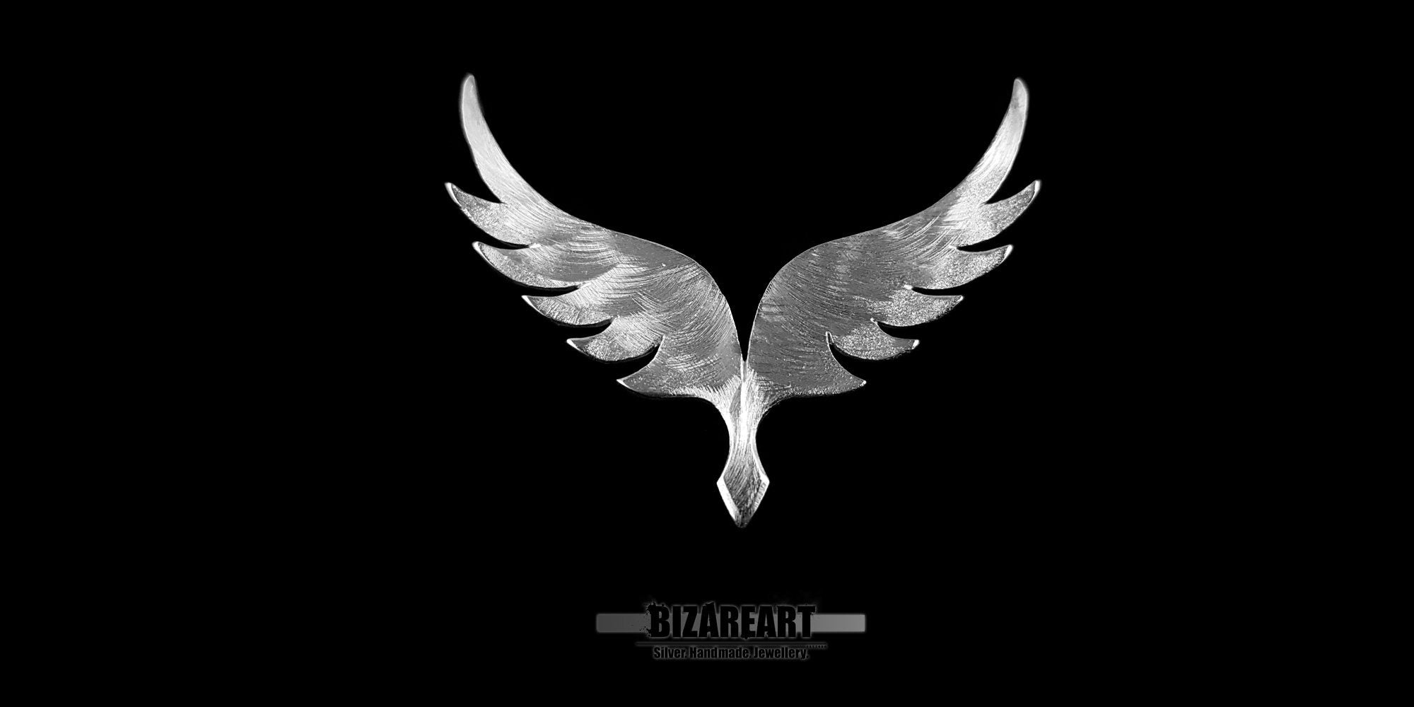 Front view of the Angel Wings v5.0 silver pendant centered against a high-contrast black background, highlighting the intricate "sweet swirl" texture and polished 925 sterling silver finish.
