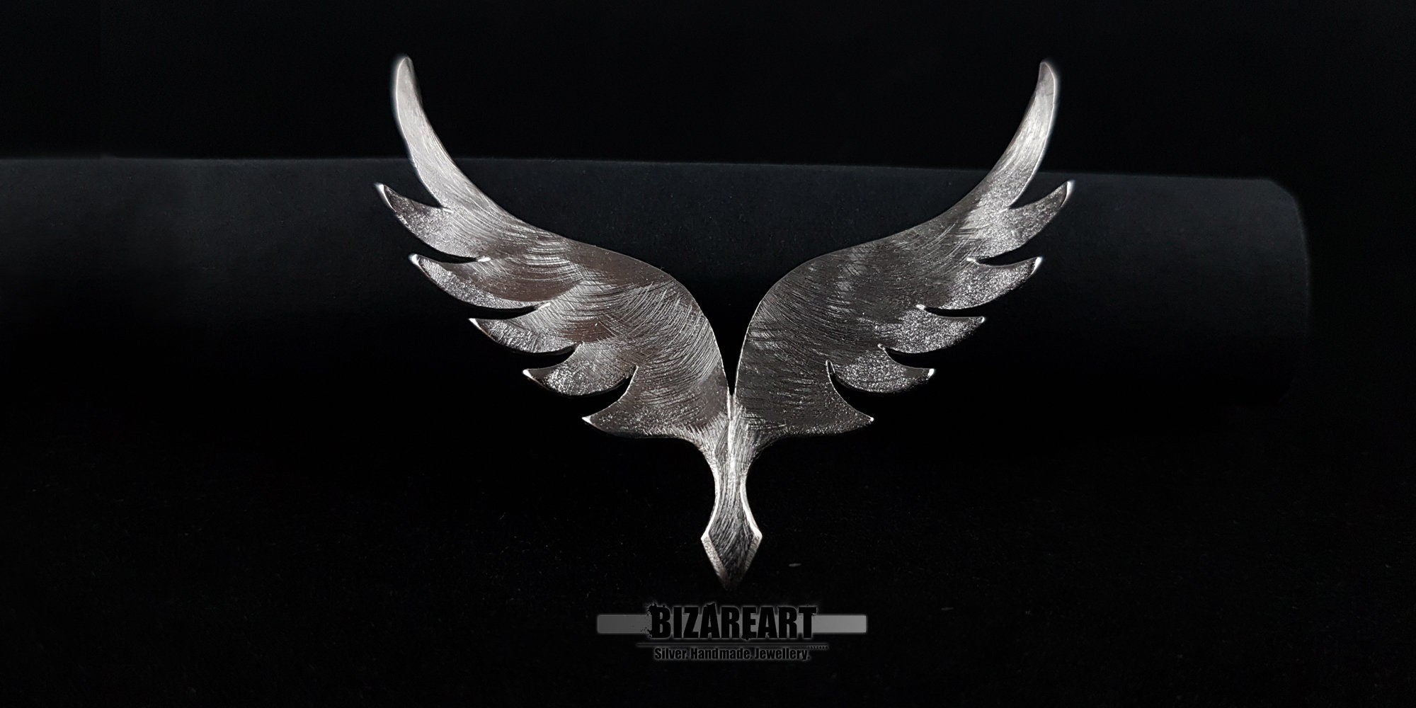 The Angel Wings v5.0 pendant displayed on a dark jewelry mount to show the scale and 5cm height of the piece.