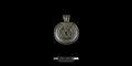 Front-facing studio shot of a handcrafted round 925 sterling silver pendant with intricate hammer-textured patterns and dark oxidized details against a black background.