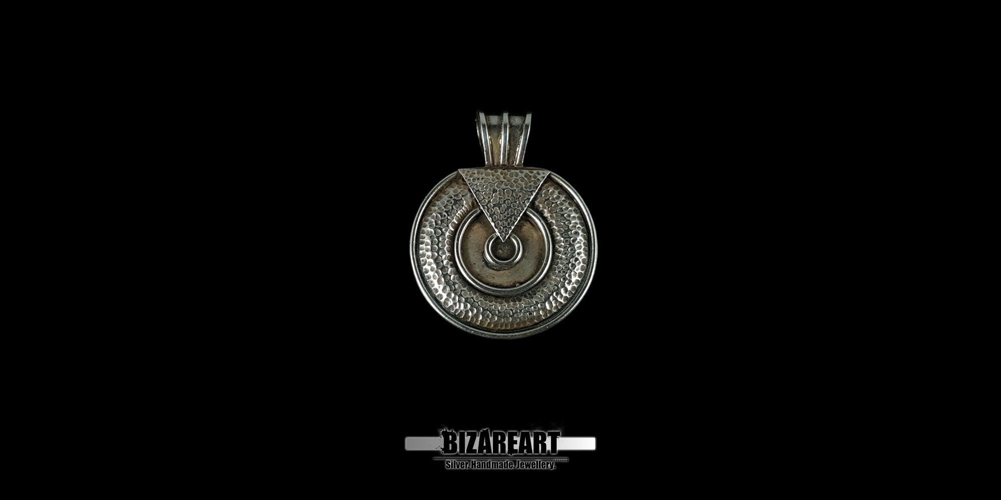 Front-facing studio shot of a handcrafted round 925 sterling silver pendant with intricate hammer-textured patterns and dark oxidized details against a black background.
