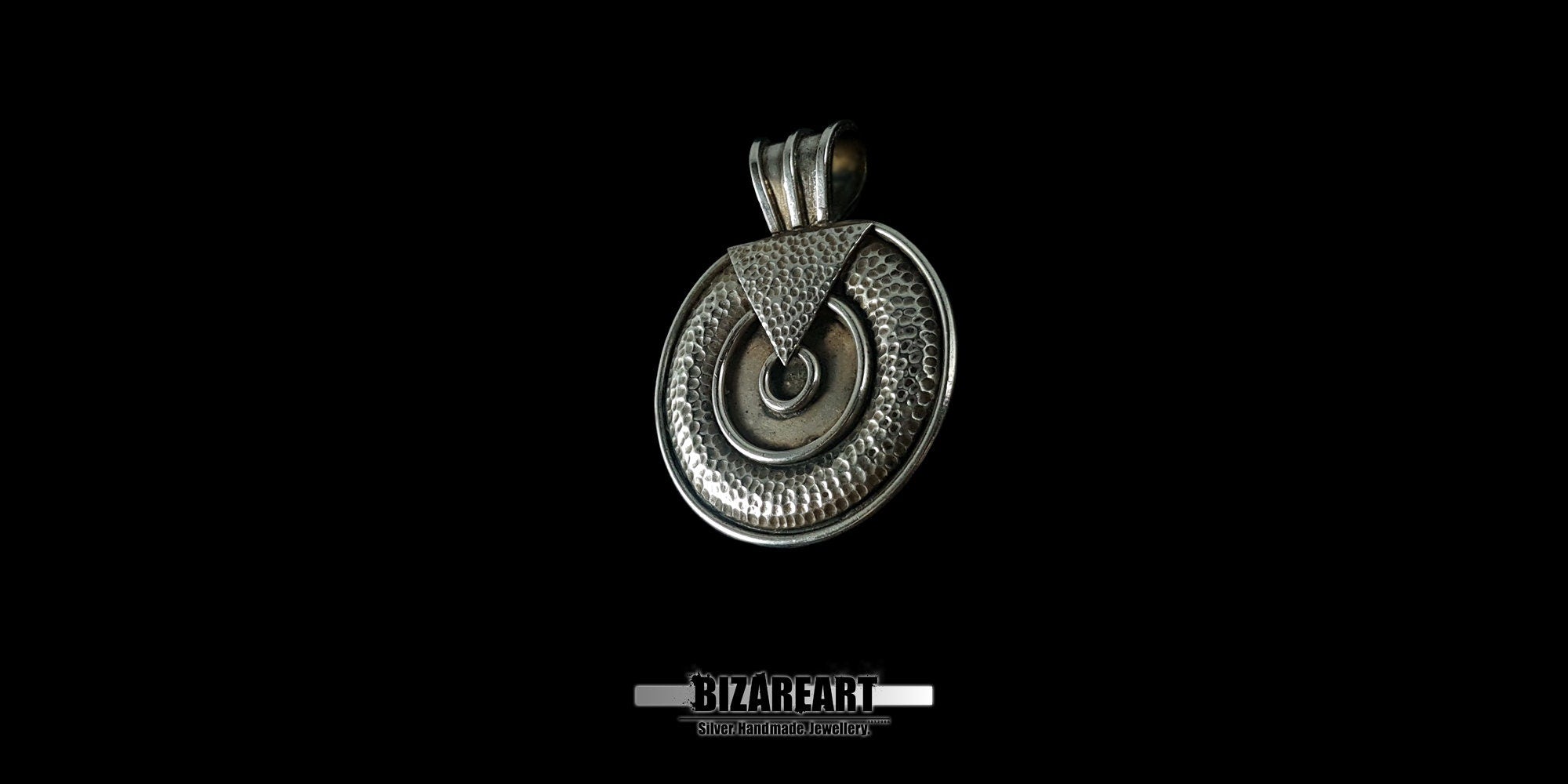 Close-up shot of the pendant's surface showcasing the high-contrast silver oxidation and the precision-soldered geometric design elements.