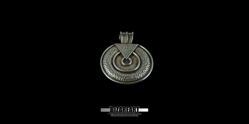 Symmetrical view of the oxidized silver pendant, emphasizing the artistic fusion of circular textures and the smooth, polished inner ring.